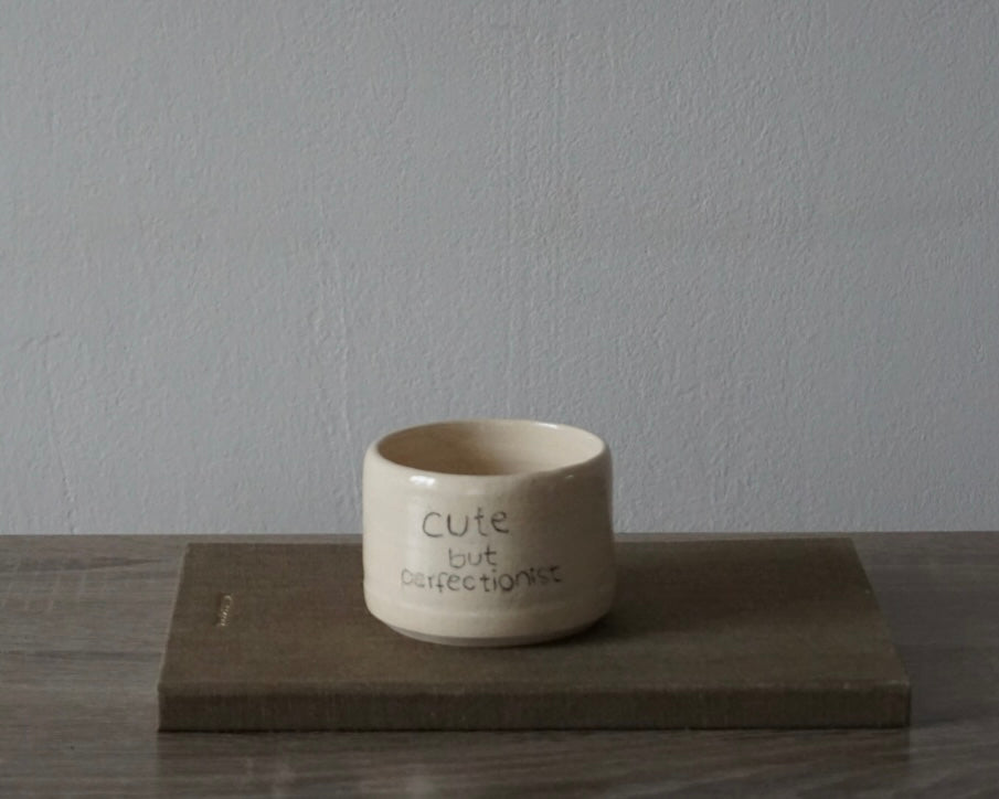 'cute but perfectionist' becher